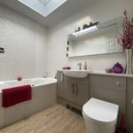 En-suite bathroom installation with bath and vanity unit