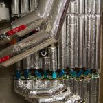 Insulated pipework and valves in a commercial plant room