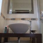 En-suite with vessel basin and mirror