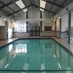 Indoor swimming pool heated by a commercial installation