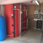Buffer vessel, expansion tank and pipework in a plant room