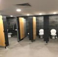 Commercial washroom with cubicles installed by Read & Errington