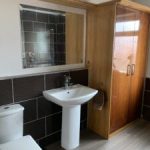 Bathroom with pedestal basin and toilet